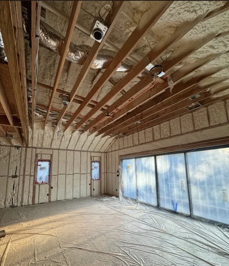 Interior walls and ceiling insulated with spray foam during new construction in Groves
